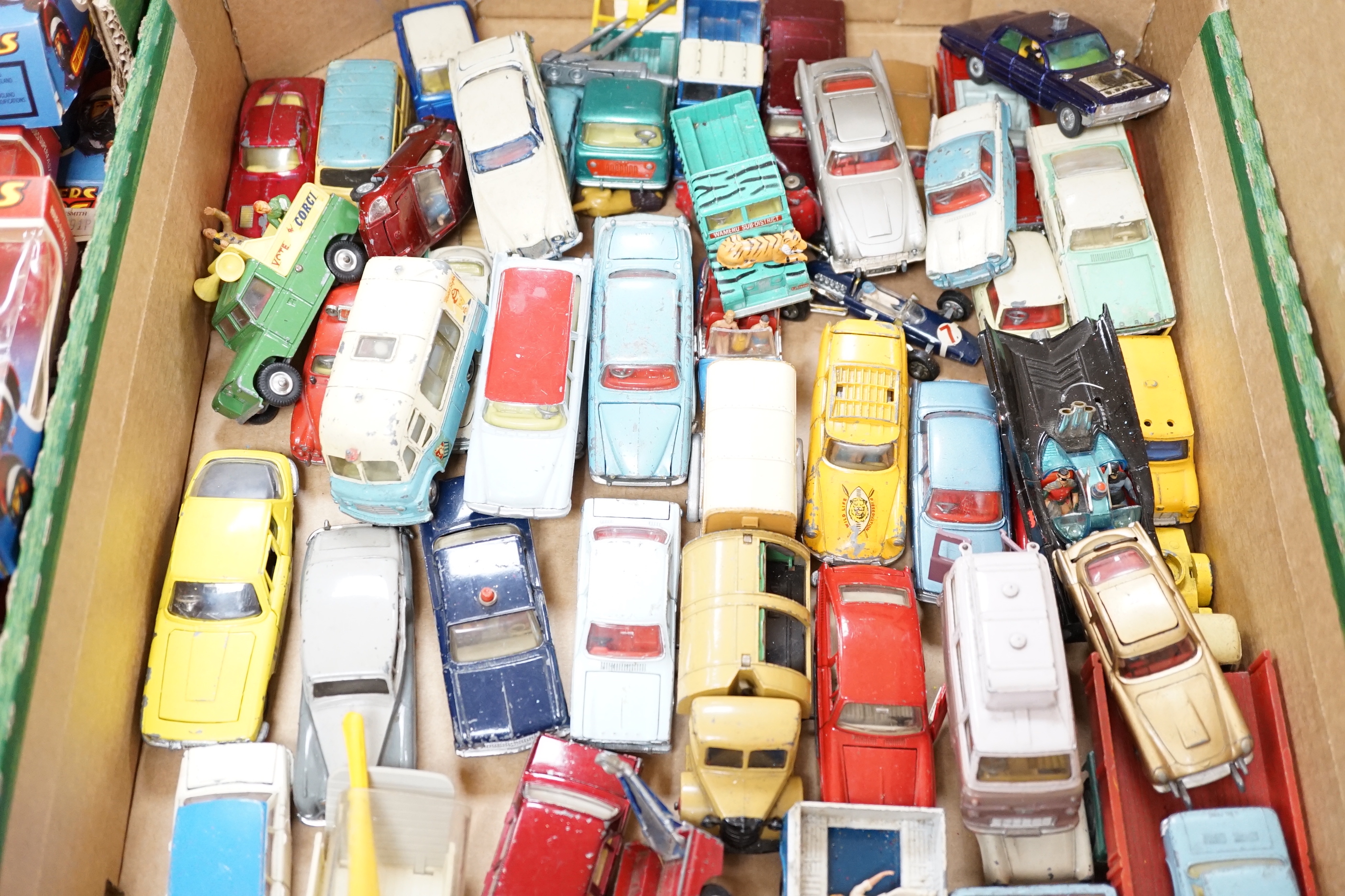 A collection of diecast vehicles by Corgi Toys, Dinky, Spot-On, Matchbox, etc. including 38, corgi toys; a Batmobile, a gold James Bond Aston Martin, a Man From UNCLE Oldsmobile, etc. 18 Husky Toys, ten Dinky Toys, etc.